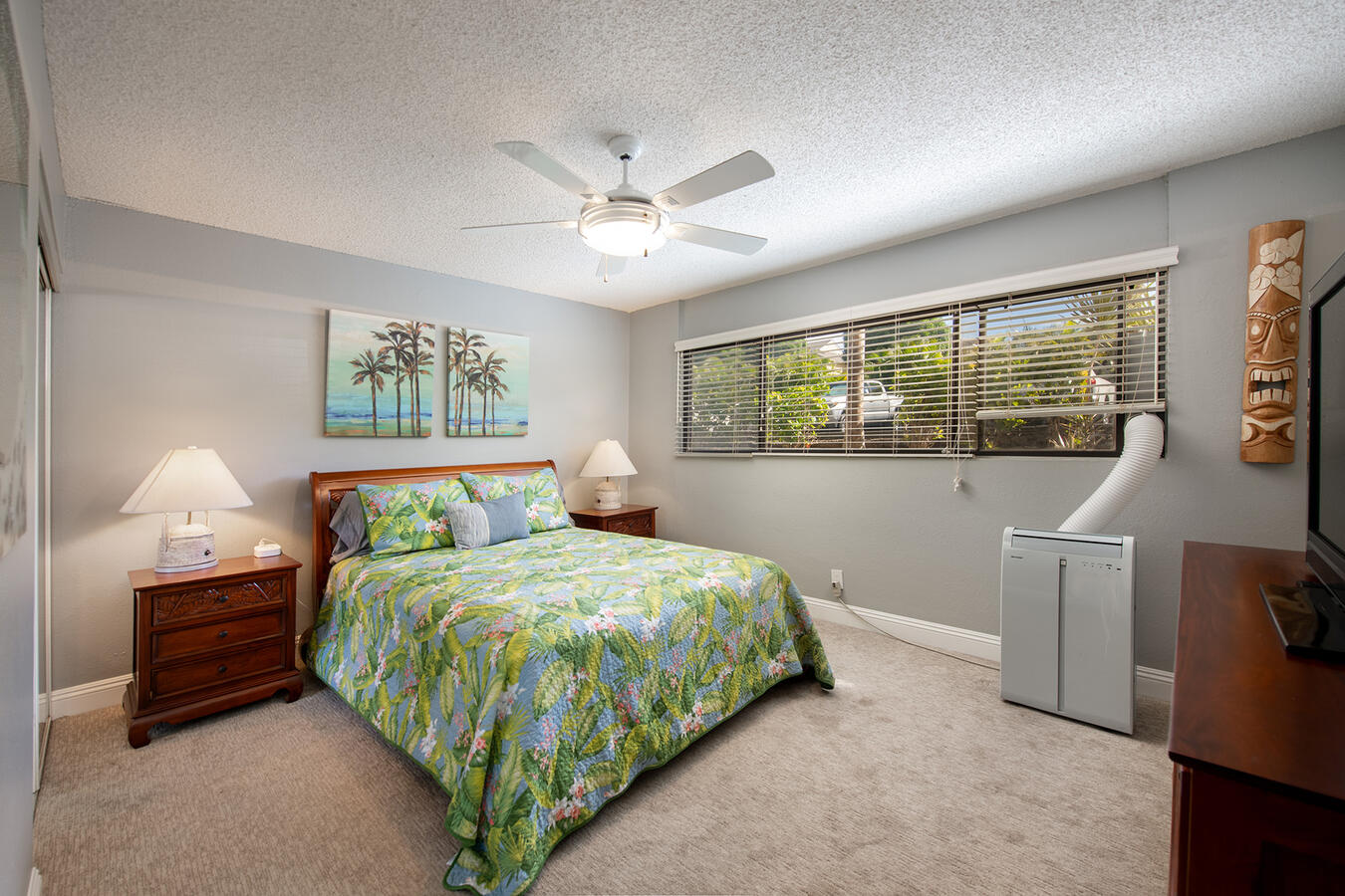 The Primary Retreat — A comfortable sanctuary for a restful night's sleep. This suite features dedicated air conditioning, offering a crisp, cool environment for those who prefer it.
